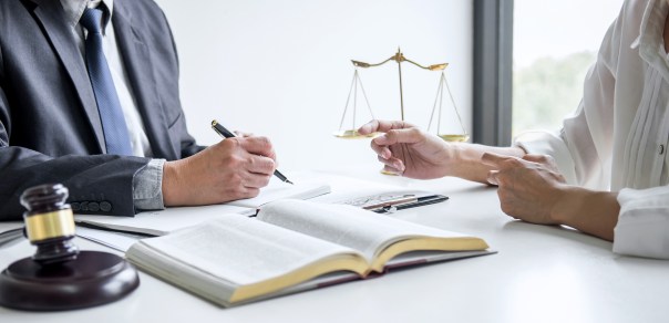 Businesswoman and Male lawyer or judge consult and conference having team meeting with client at law firm in office, Law and Legal services concept